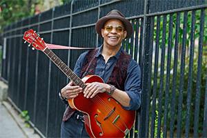 Guy Davis holding a guitar